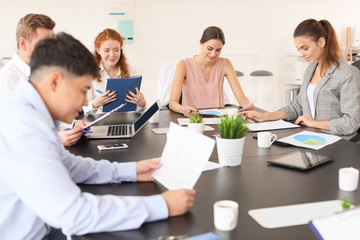 Group of business people during meeting in office