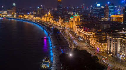 The bund at night, The Bund is a financial district and business centre in the city, Shanghai Bund historical buildings old colonial buildings, Popular tourist destination, Aerial view, China. - obrazy, fototapety, plakaty