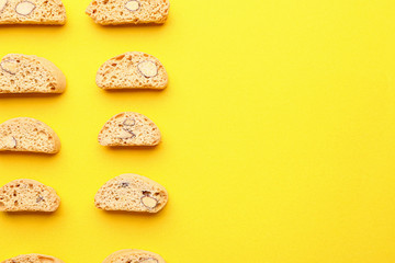 Sweet almond cookies on color background