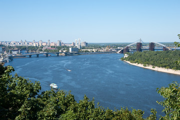 Ukraine, Kiev city – 24.07.2012: construction of the Podolsk-Voskresensky bridge across the Dnieper River. landscape