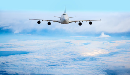 Passenger airplane in the clouds. travel by air transport