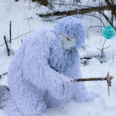Yeti fairy tale character in winter forest.