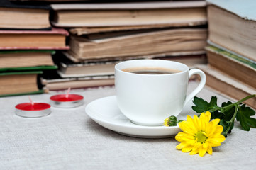 cup of coffee and yellow flower