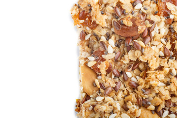 Homemade granola from oat flakes, dates, dried apricots, raisins, nuts isolated on white background. top view.