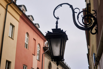 Fototapeta na wymiar Old lantern on the wall of a building.
