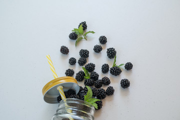 Fresh blackberries in a transparent glass