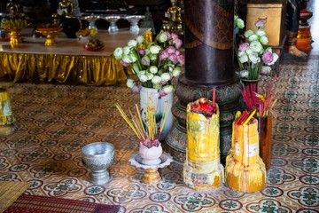 Votive candles inside Wat Phnom, Phnom Penh, Cambodia
