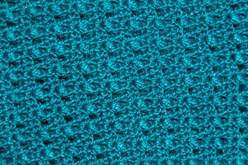 Texture of blue binding in holes. Knitted pattern. Original binding of the canvas.