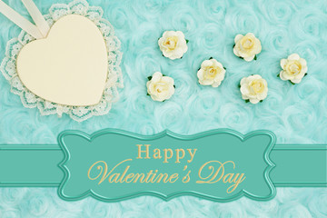 Happy Valentine's Day greeting with a heart with lace on pale teal rose plush fabric