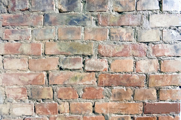 Dirty brick wall with spots and stains, old decorative wall
