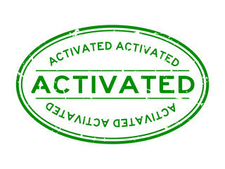 Grunge green activated word oval rubber seal stamp on white background