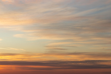 Fototapeta na wymiar Beautiful dramatic sunset orange sky with clouds background