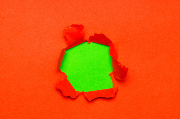 Naklejka na ściany i meble torn hole on red paper