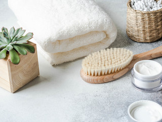 Various items for the care of women's skin in the bathroom on grey background. Copy space