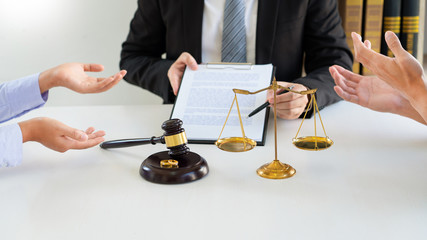 Judge gavel deciding on agreement prepared marriage divorce and Angry couple arguing telling their...