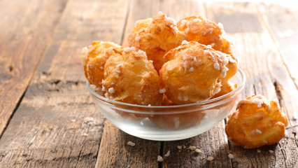 chouquette, french choux pastry on wood background