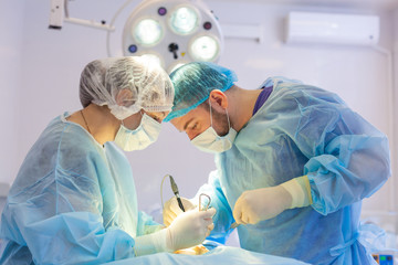 Hospital. Surgeon operates in the operating room. Surgeons save life to the injured.