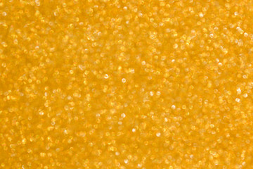 Gold background light. Golden glitter texture.