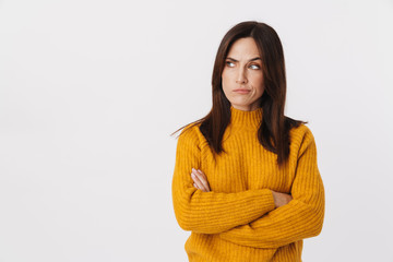 Image of negative adult woman frowning and standing with arms crossed