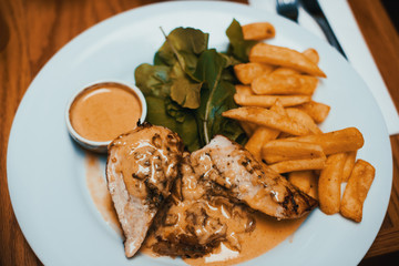 Grilled chicken fillet with parmesan sauce.