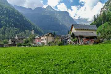 Fototapeta na wymiar The village of Sonogno in Val Verzasca with houses made with stones and wood