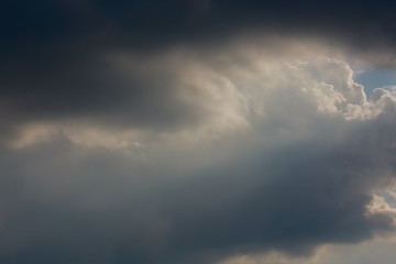Naklejka na ściany i meble sunlight through cloud on dramatic sky after the rain