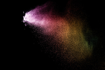 Fototapeta na wymiar Explosion of colored powder isolated on black background. Abstract colored background. holi festival.