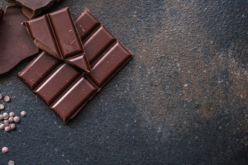 chocolate (delicious cocoa dessert, pieces ofbackground. top view. copy space sweets) menu concept. food 