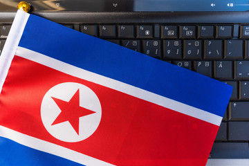 flag of North Korea on computer, laptop keyboard
