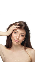 Fototapeta premium Beautiful female face with lifting up arrows isolated on white background. Concept of bodycare, cosmetics, skincare, correction surgery, beauty and perfect skin. Copyspace for your ad. Antiaging.
