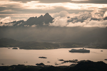 Cruise ship in Lofoten islands near to Ballstad town and Leknes town. Cruising boat around archipelago 