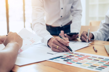 Designer team drawing website ux app development application for mobile phone.