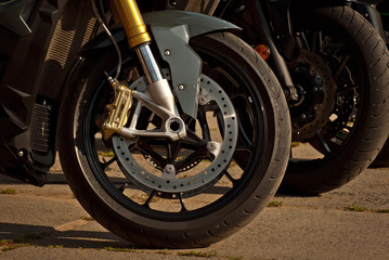 Motorcycle wheel closeup. Motorcycle metal parts. Biker meeting in the city.