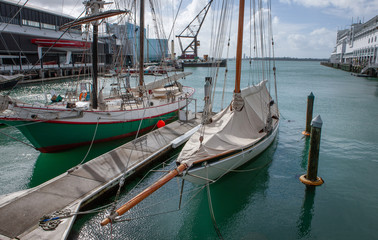 Fototapeta na wymiar Auckland New Zealand. Old historic boats. Maritime Museum. Harbor