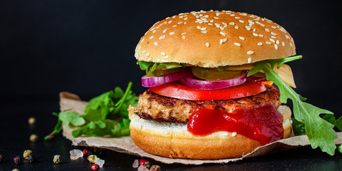 burger, meat cutlet beef steak, tomato, sauce and lettuce (tasty meat snack sandwich) menu concept. food background. top view. copy space