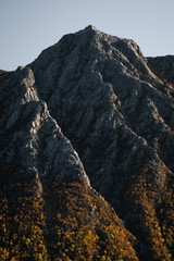 Amazing mountain formation looks like mountains are dancing. Lovely soft and warm and calming fall colours.  Located in Lofoten Islands, Norway.