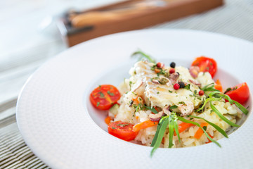 Andalusian fish, saffron rice with vegetables