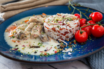 risotto with fresh cream, salted chicken, rehydrated ceps and mushrooms