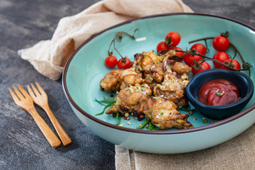 delicious fried chicken wings with sauce