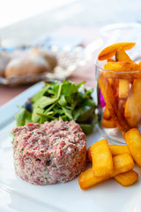 tasty Steak tartare (Raw beef) - classic steak tartare on white plate