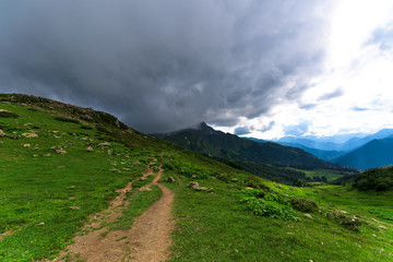 panorama of the Alpine mountains . mountain tourism. Caucasian mountains. summer landscape with mountains. flowers, blue sky, fresh air