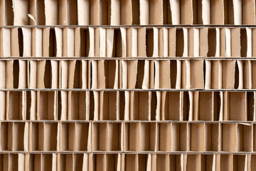 Corrugated cardboard is used for packaging which requires mechanical strength and impact resistance. Corrugated cardboard abstract texture background.