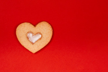 Cute handmade cookies in the shape of heart on red background. Concept of the Valentine's Day, surprises with love, holiday, etc. Flat lay, copy space.