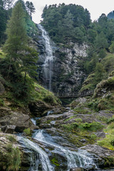 Fototapeta na wymiar Froda waterfall in Val Verzasca with green water (switzerland)