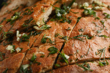 Tasty garlic bread texture background, close up