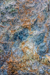 Amazind multicolored background texture of natural rock stone. Vertical oriental photo.