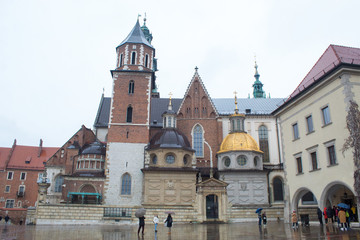 Fototapeta na wymiar The most famous Polish Royal Cracow Wawel Castle on Christmas Day in rainy weather.
