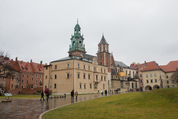 Fototapeta na wymiar The most famous Polish Royal Cracow Wawel Castle on Christmas Day in rainy weather.