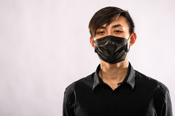 Obraz na płótnie Canvas Concept of coronavirus quarantine. MERS Cov middle East respiratory syndrome coronavirus, Novel coronavirus 2019nCoV, Asian man with medical face mask