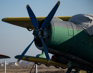 Old airplanes. Green and blue corncob. Sports plane of the 19th century. Until now they fly. Touch...